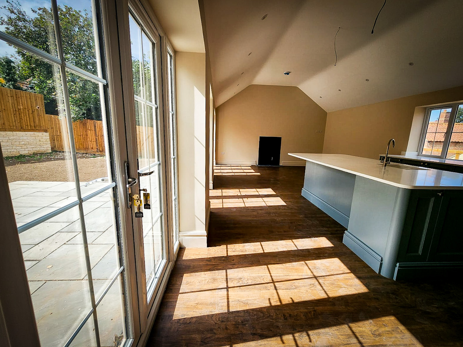 Open-plan interior with French doors in Corby Glen new build
